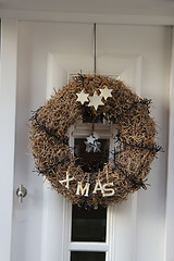 Image showing Modern door with christmas wreath