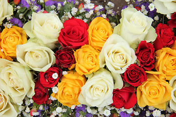 Image showing Yellow, white and red roses in a wedding arrangement