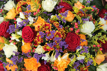 Image showing Mixed floral arrangement in yellow, red and white