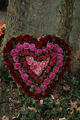 Image showing Heart Shaped Sympathy flowers in red and pink