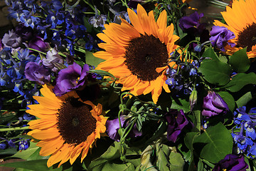 Image showing Sunflowers and purple eustoma