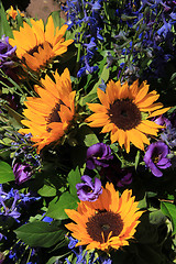 Image showing Sunflowers and purple eustoma