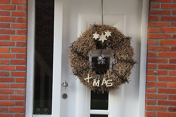 Image showing Modern door with christmas wreath