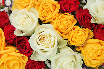 Image showing Yellow, white and red roses in a wedding arrangement