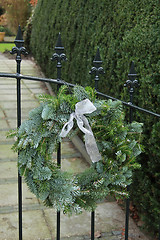 Image showing Christmas wreath on a fence