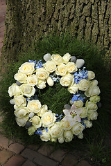 Image showing White roses on a sympathy wreasth
