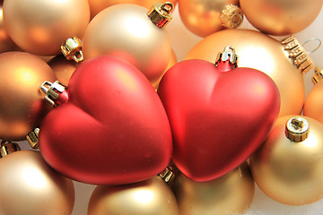 Image showing red heart shaped christmas ornaments