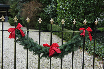 Image showing Garland on a fence