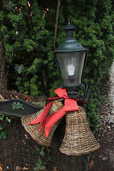 Image showing Ratan Christmas decorations on a fence