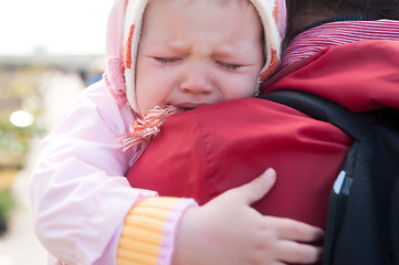 Image showing crying baby on mother shoulder