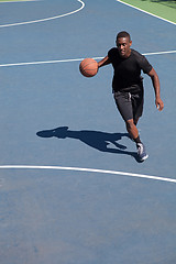 Image showing Basketball Player Dribbling