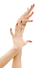 Image showing two hands with red nails