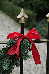 Image showing Red bow on a garland