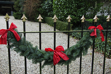 Image showing Garland on a fence