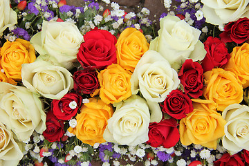 Image showing Yellow, white and red roses in a wedding arrangement