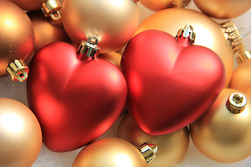 Image showing red heart shaped christmas ornaments