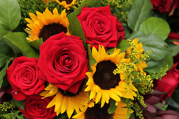 Image showing Red roses and sunflowers in a floral arrangement