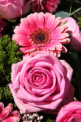 Image showing Ranunculus, roses and gerberas in a wedding arrangement