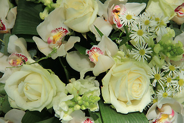 Image showing Orchids and roses in bridal bouquet