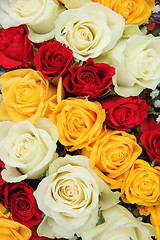 Image showing Yellow, white and red roses in a wedding arrangement