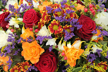 Image showing Mixed floral arrangement in yellow, red and white