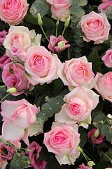 Image showing Pink wedding centerpiece: roses and eustoma