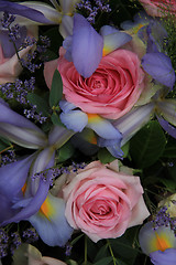 Image showing Blue irises and pink roses in bridal arrangement