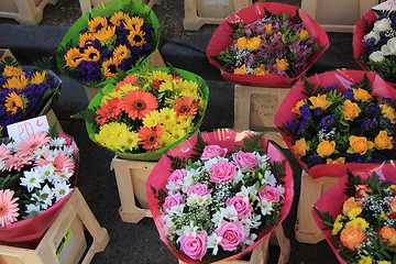 Image showing Colorful bouquets at a market