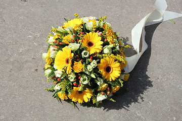 Image showing Yellow sympathy flowers