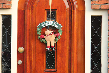 Image showing Christmas decorations on a door