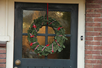 Image showing Christmas wreath on a door