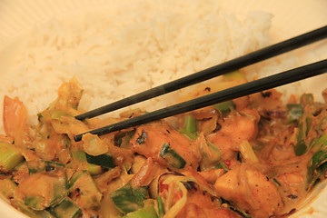 Image showing Asian food with chopsticks