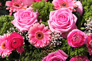 Image showing Ranunculus, roses and gerberas in a wedding arrangement