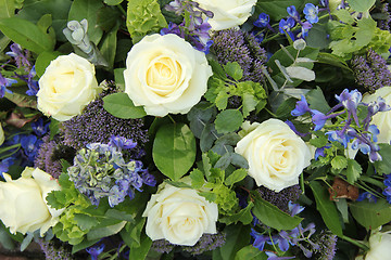 Image showing Blue White Flower arrangement for a wedding