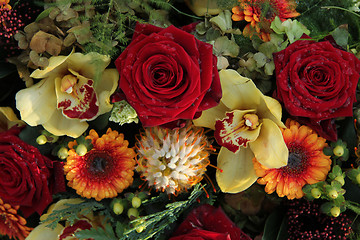 Image showing roses and orchids in a flower arrangement