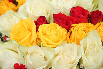 Image showing Yellow, white and red roses in a wedding arrangement