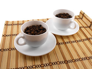 Image showing Coffee cup set top view on bamboo table