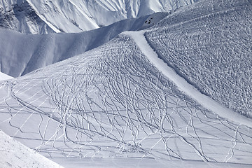 Image showing Off-piste and groomed slope with trace from ski and snowboards