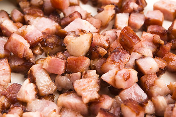 Image showing Macro photo of bacon being fried in a pan