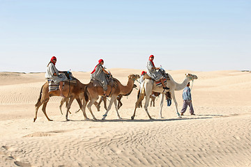 Image showing Berber leading tourists on camels