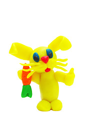 Image showing Yellow plasticine rabbit with carrot