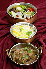 Image showing Beef rogan josh with rice and salad