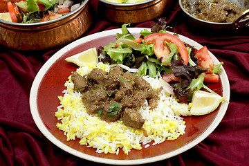 Image showing Beef rogan josh dinner with bowls