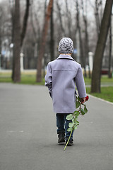 Image showing Little boy walking the park