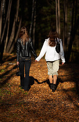 Image showing Girls walking in the forest