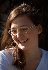 Image showing Smiling girl with eyeglasses