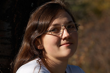 Image showing Smiling girl with eyeglasses