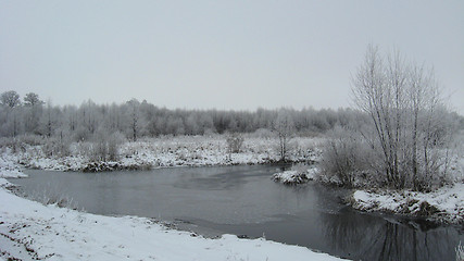 Image showing Winter landscape with unfrozen river and snow