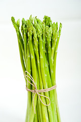 Image showing fresh asparagus over white