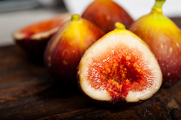 Image showing fresh figs over old wood